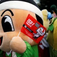 A mascot cheers  on racers during ISU-1 Hanyu Grand Prix. | REUTERS