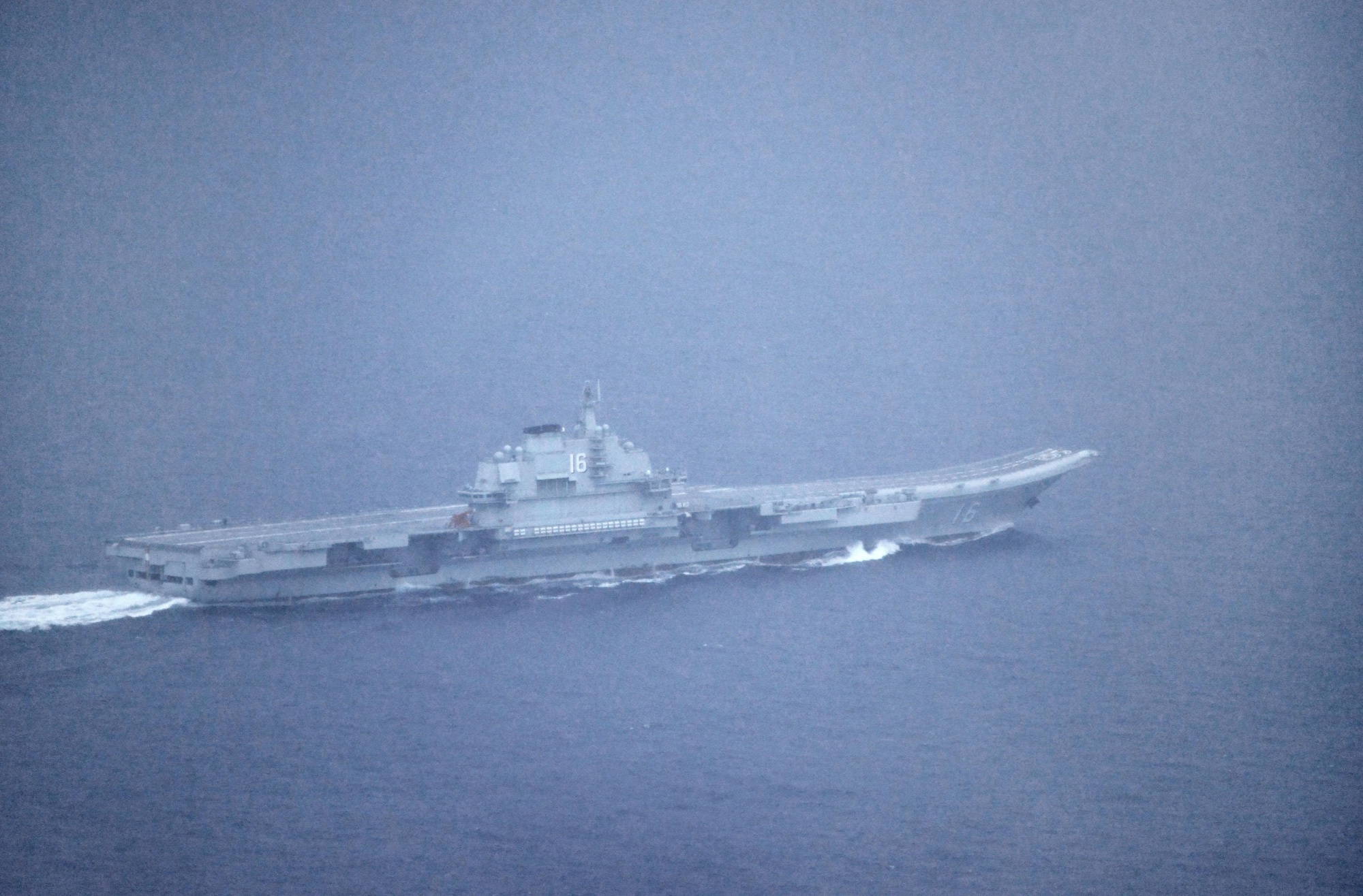 This photo provided by the Defense Ministry shows China's aircraft carrier, the Liaoning, headed to the Pacific on Monday. | KYODO