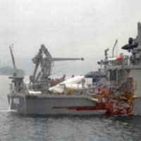 Notojima, a Maritime Self-Defense Force minesweeper, is seen damaged Thursday after a collision with a cargo ship off the coast of Hiroshima Prefecture. | ONOMICHI COAST GUARD OFFICE / VIA KYODO