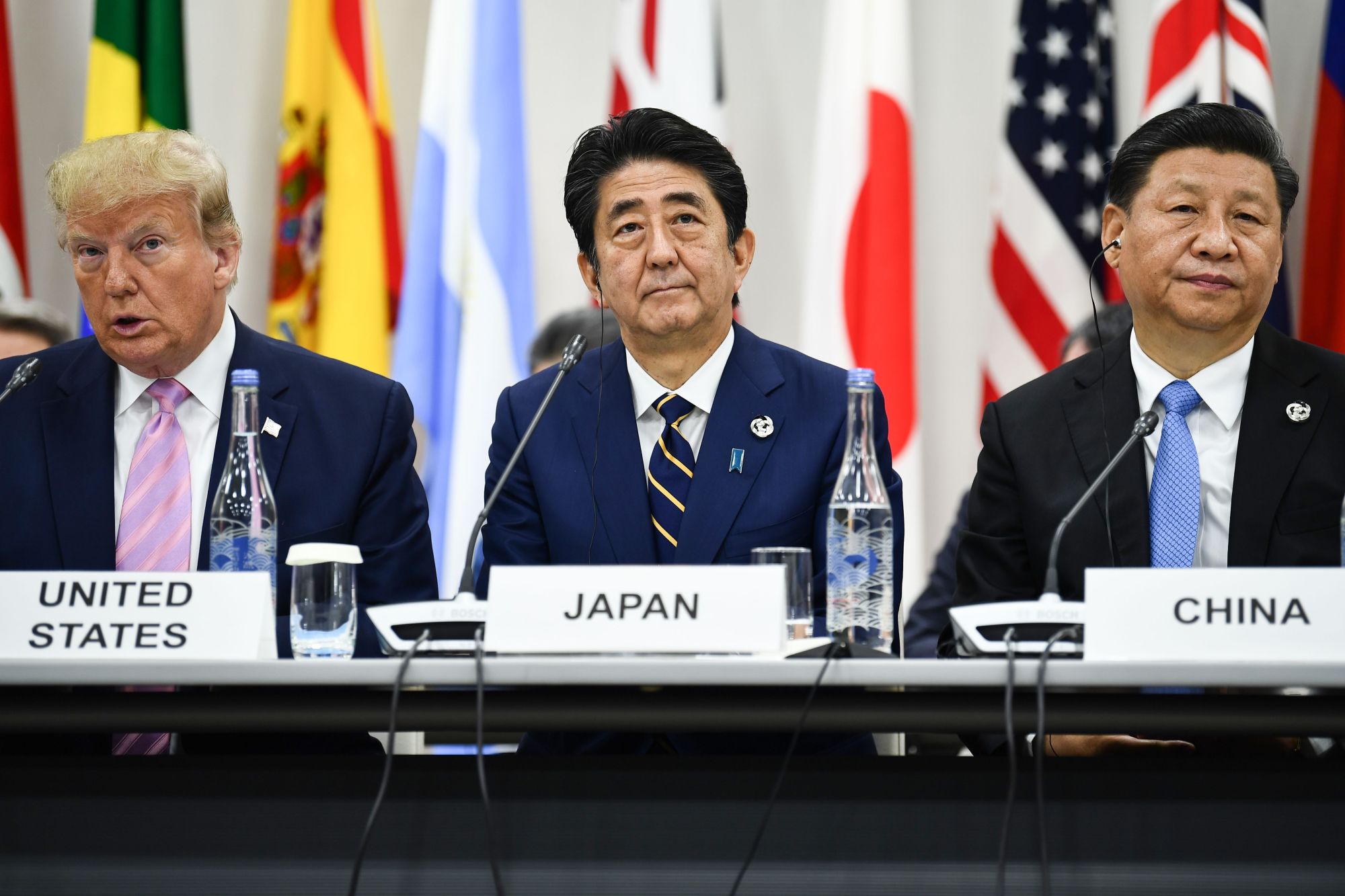 U.S. President Donald Trump, Prime Minister Shinzo Abe and Chinese President Xi Jinping attend a trilateral meeting at the Group of 20 summit Friday in Osaka. | AFP-JIJI