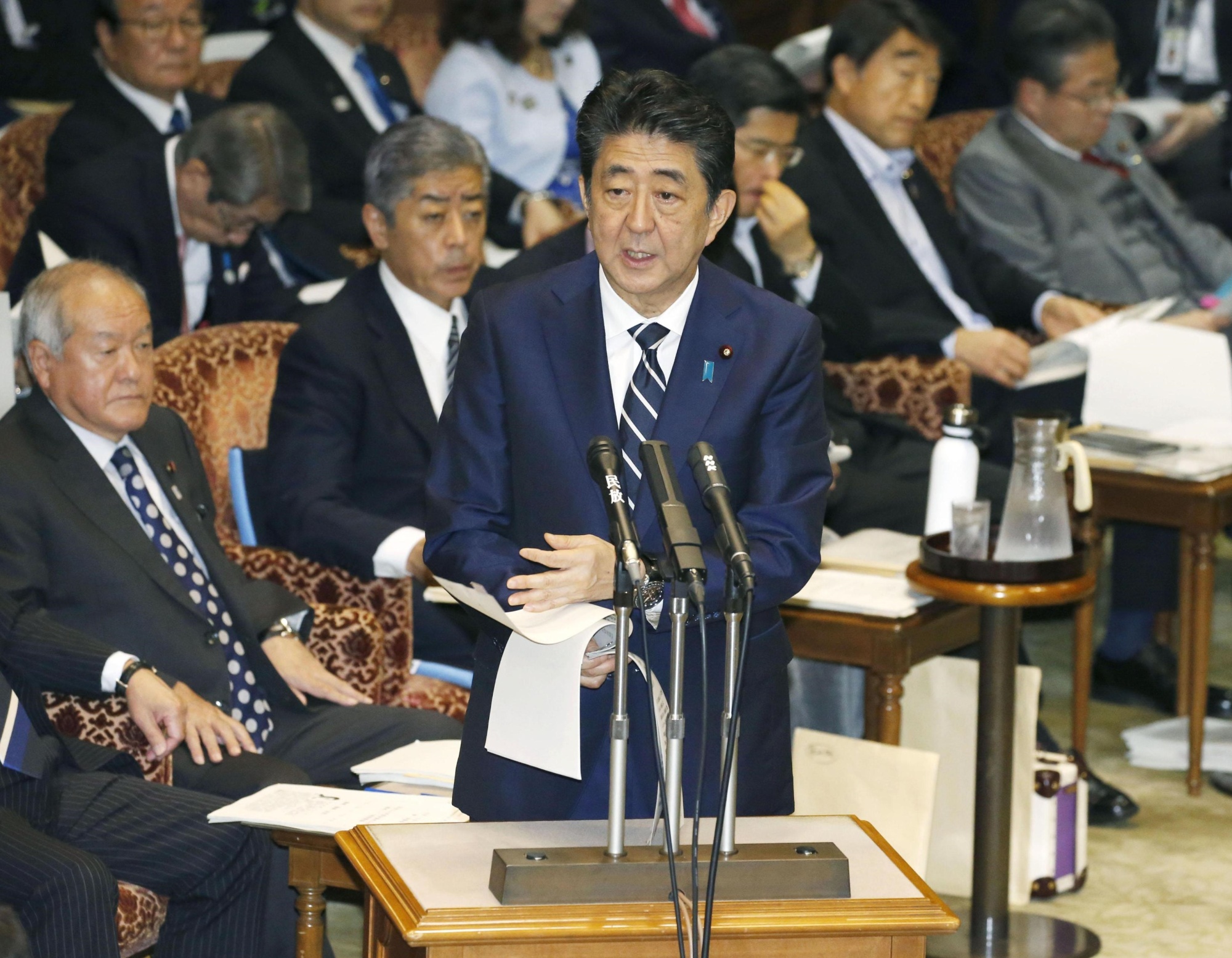 Prime Minister Shinzo Abe answers a question during a Diet committee meeting on Monday. | KYODO