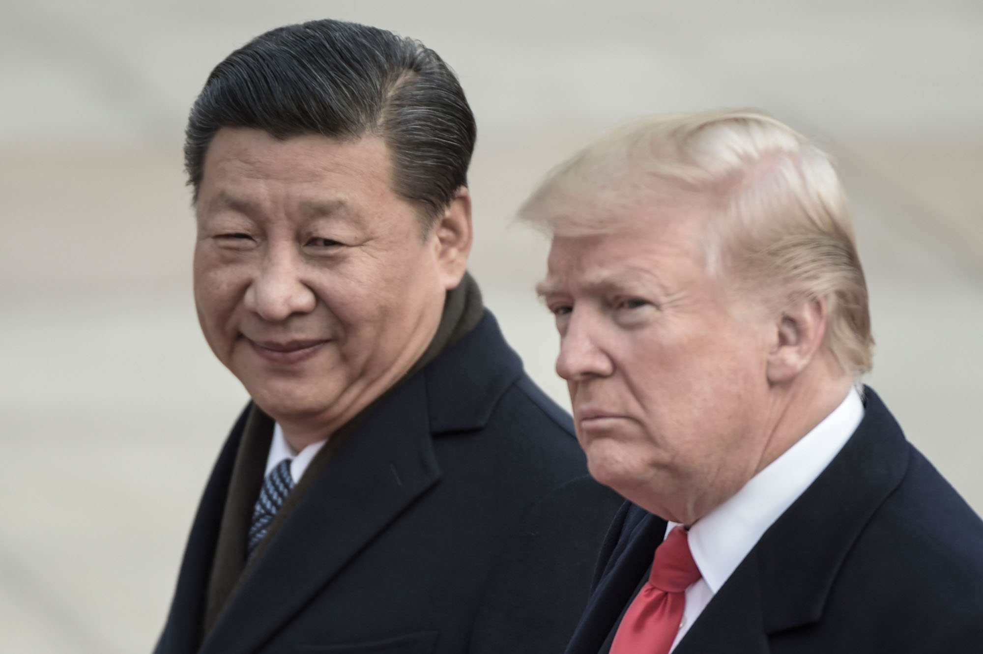 Chinese President Xi Jinping and U.S. President Donald Trump attend a welcome ceremony at the Great Hall of the People in Beijing in November 2017. | AFP-JIJI