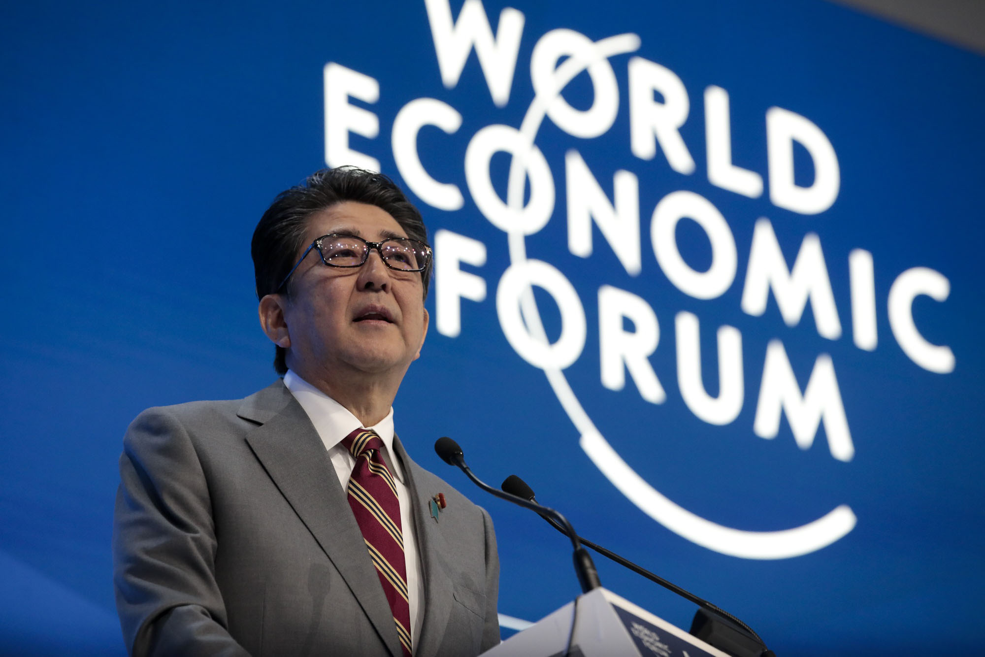Prime Minister Shinzo Abe delivers a speech during a special address on the second day of the World Economic Forum's annual meeting in Davos, Switzerland, on Jan. 23. | BLOOMBERG