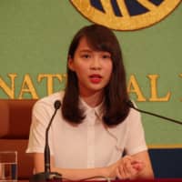 Agnes Chow, a 22-year-old democratic movement leader from Hong Kong, speaks during a news conference in Tokyo on Monday after participating in a massive protest march against a controversial extradition bill the previous day in the former British territory. | REIJI YOSHIDA