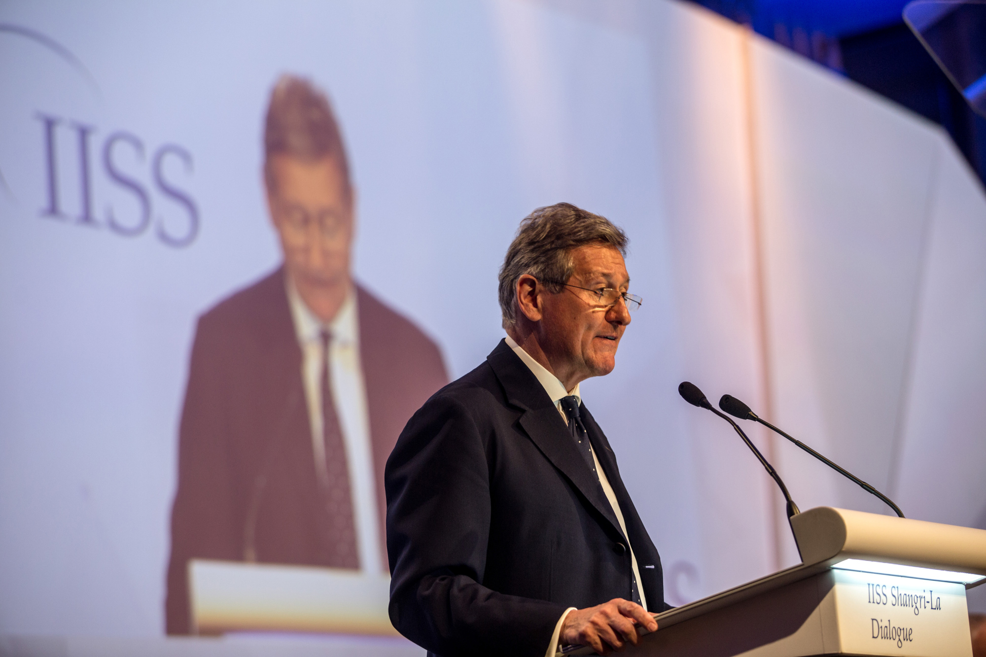 John Chipman, director-general of the IISS, speaks during the Shangri-La Dialogue  in Singapore on June 2017. | BLOOMBERG