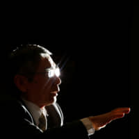 BOJ Gov. Haruhiko Kuroda speaks during a group interview in Tokyo in 2013. The Bank of Japan has pushed back the timing for hitting its inflation target on six occasions.  | REUTERS