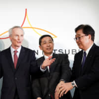 Renault CEO Thierry Bollore (left), Chairman Jean-Dominique Senard, and Nissan Motor President and CEO Hiroto Saikawa  attend a news conference in Yokohama in March. | BLOOMBERG
