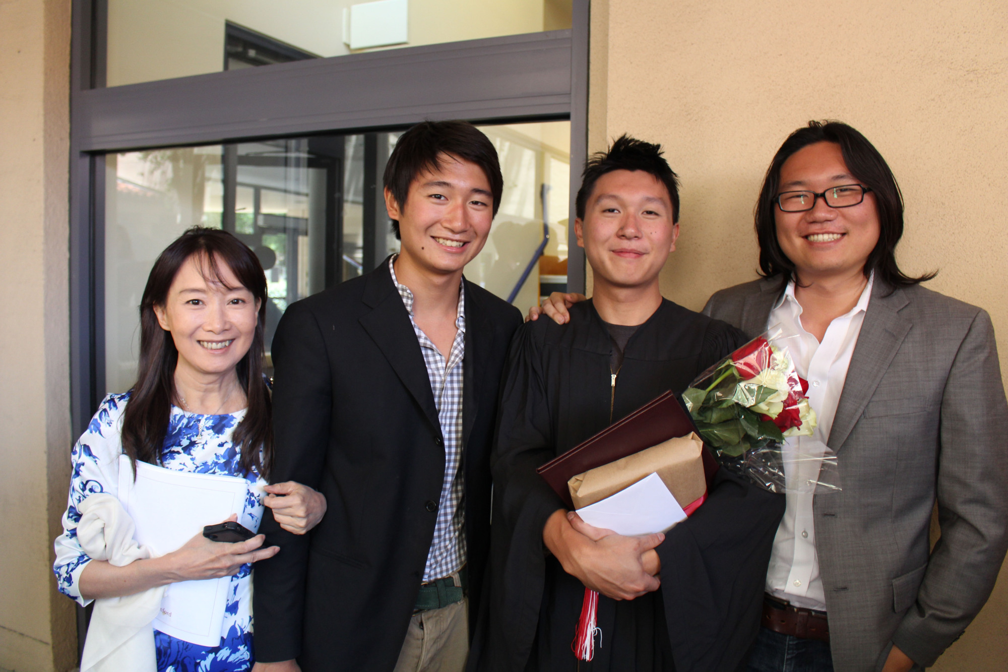 Agnes Chan poses with her three sons at her second son Shohei's graduation ceremony at Stanford University in 2015. | COURTESY OF T&AMP;A / VIA KYODO