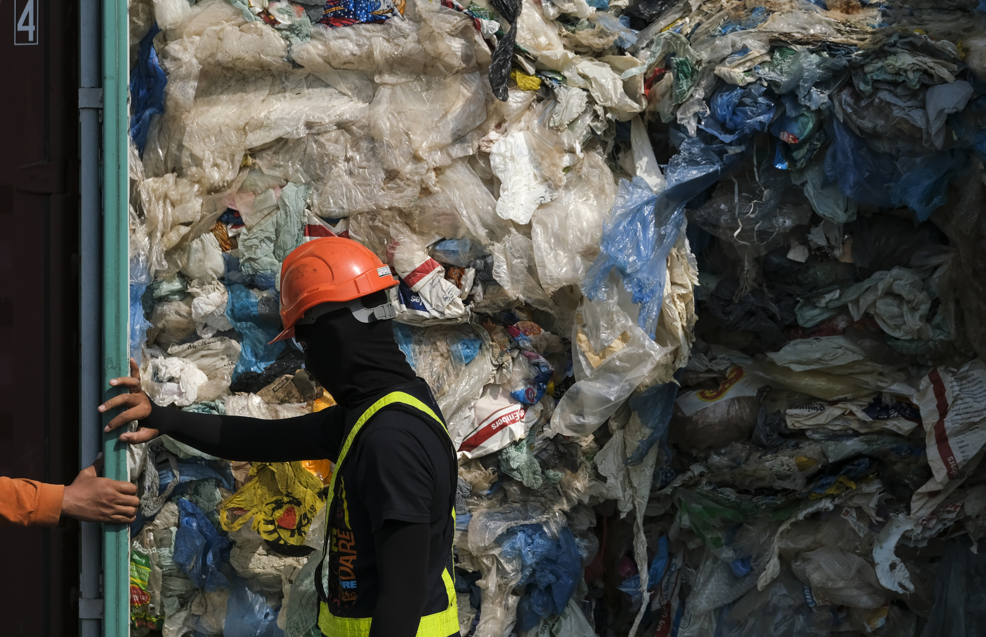 Containers filled with plastic waste are seen on display at Port Klang in Selangor state, Malaysia, on Tuesday. | BLOOMBERG
