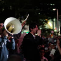 A man addresses the demonstrators who gathered in Shibuya for a protest against Hong Kong\'s proposed extradition law.  | RYUSEI TAKAHASHI