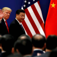 U.S. President Donald Trump and Chinese President Xi Jinping visit the Great Hall of the People in Beijing in November 2017. | REUTERS