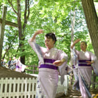 Women take part in the ‘Nanyadoyara’ dance around the purported grave of Jesus Christ during the Christ Festival in Shingo, Aomori Prefecture. | COURTESY OF SHINGO VILLAGE