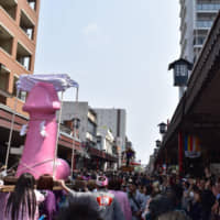 Participants carry a giant effigy of a penis during the Kanamara Festival in Kanagawa Prefecture. | COURTESY OF OMATSURI JAPAN