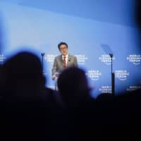 Prime Minister Shinzo Abe delivers a speech during a special address to the World Economic Forum in Davos, Switzerland, on Jan. 23, 2019.  | BLOOMBERG