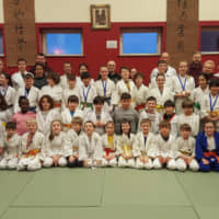 Community spirit: Mina Ishihara (second row from top, second from left), who has a 1st dan black belt in judo, at The Galway Judo Club, with some of the young students who she volunteer coaches. | MINA ISHIHARA