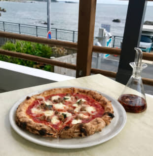 Picture perfect: Salsiccia pizza with a view of Sagami Bay. | ROBBIE SWINNERTON