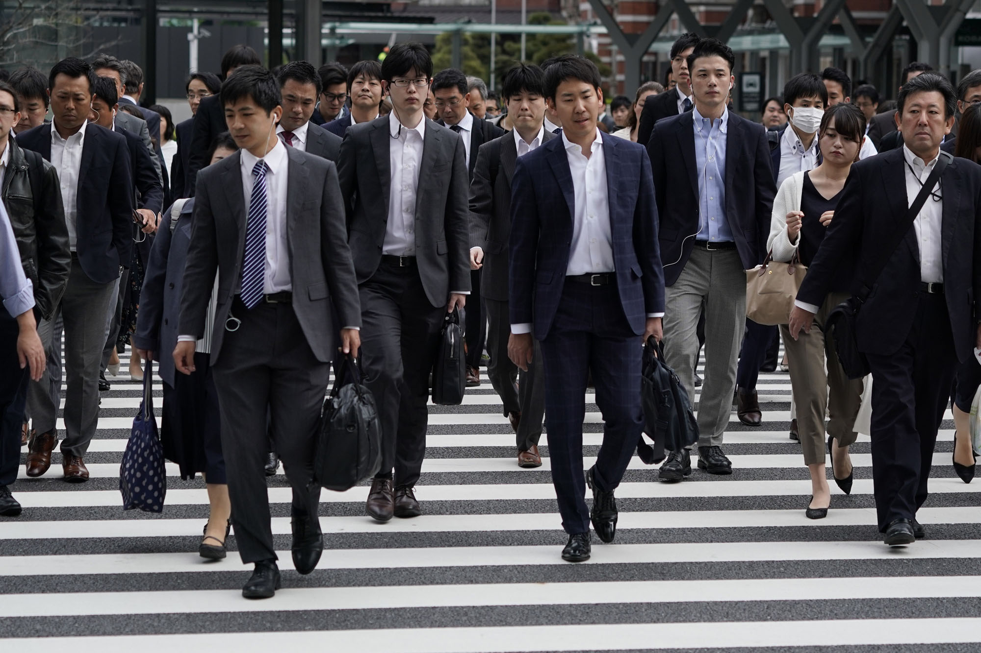 OECD data suggests that as a percentage of corporate value-added, Japanese firms pays the lowest share to employee compensation in the OECD: 32 percent for large listed corporations and 40 percent for small and medium-size ones. In Germany, the figures are 78 and 71 percent, respectively. | BLOOMBERG