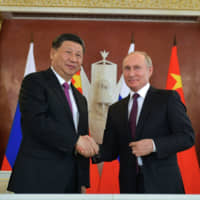 There is a sense in Beijing and Moscow that the combination of Chinese economic power and Russian political audacity can help the two countries better withstand U.S. challenges. | AFP-JIJI