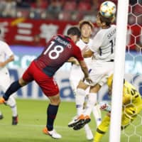 Serginho scores on a header past Sanfrecce goalkeeper Hirotsugu Nakabayashi in the 24th minute in an Asian Champions League match on Tuesday at Kashima Stadium. | KYODO
