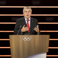 IOC President Thomas Bach speaks during the 134th IOC Session in Lausanne, Switzerland, on Tuesday. | AP