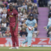 West Indies\' Carlos Brathwaite reacts after being hit for four by England\'s Joe Root in a Cricket World Cup match in Southampton, England, on Friday. | AP