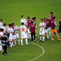 Japan\'s players gather after their 1-1 draw against Ecuador on Monday in Belo Horizonte, Brazil. | REUTERS