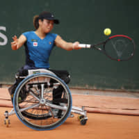 Yui Kamiji plays a shot against Netherlands\' Diede de Groot during Saturday\'s women\'s wheelchair singles final match of the French Open in Paris. | AP