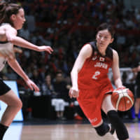 Japan point guard Mai Kawai dribbles against Belgium in their exhibition game in Mito, Ibaraki Prefecture, on Sunday. The Akatsuki Five complete a two-game sweep. | KAZ NAGATSUKA