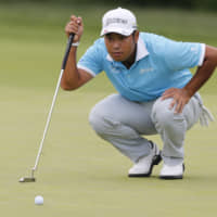 Hideki Matsuyama lines up his put on the first hole of the final round of the Memorial Tournament on Sunday in Dublin, Ohio. | AP