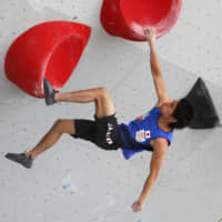 Tomoa Narasaki competes during the men\'s bouldering final of the International Federation of Sport Climbing World Cup on Saturday in Vail, Colorado. Narasaki took second place in the event to win the overall series. | AP