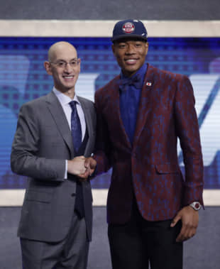 NBA commissioner Adam Silver poses with Rui Hachimura after the Washington Wizards selected him as the ninth pick in the first round of the NBA Draft on Thursday night in New York. | AP