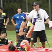 Brave Blossoms coach Jamie Joseph oversees a practice during a training camp in Miyazaki on June 10. | KYODO