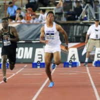 Japanese sprinter Abdul Hakim Sani Brown competes at the NCAA Division I outdoor athletics championships on Friday in Austin, Texas. Sani Brown set a new national record with a time of 9.97 seconds in the men\'s 100 meters. | AP