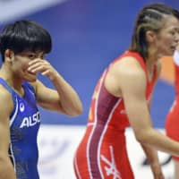 Kaori Icho reacts after her defeat to Risako Kawai in the women\'s 57-kg final during the national wrestling championships on Sunday at Komazawa Gymnasium. | KYODO