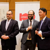 Polish Ambassador Jacek Izydorczyk (left) poses with Vice-Minister of Culture and National Heritage Pawel Lewandowski (center) and Vice-Chairman of the Japan-Poland Parliamentary Friendship Association Banri Kaieda at a press conference. | COURTESY OF THE POLISH EMBASSY