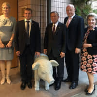 Danish Ambassador Freddy Svane (second from right) and his wife, Lise Svane (right), pose with (from left) Danish Agriculture &amp; Food Council CEO Anne Arhnung, Danish Meat Council Chairman Asger Krogsgaard and  Consumer Affairs and Food Safety Minister Mitsuhiro Miyakoshi during a reception to celebrate the EU-Japan EPA and unveiling of a new 400-kilogram pig sculpture at the Danish Embassy in Tokyo on May 23. | COURTESY OF THE DANISH EMBASSY