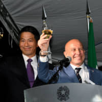 Italian Ambassador Giorgio Starace (right) gives a toast with Parliamentary Vice-Minister for Foreign Affairs Kenji Yamada during a reception to celebrate Italy\'s national day at the ambassador\'s residence on May 30. | YOSHIAKI MIURA