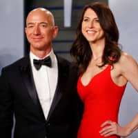 Amazon CEO Jeff Bezos and his then-wife, MacKenzie Bezos, arrive for the Vanity Fair Oscar Party in Beverly Hills, California in April last year. | REUTERS