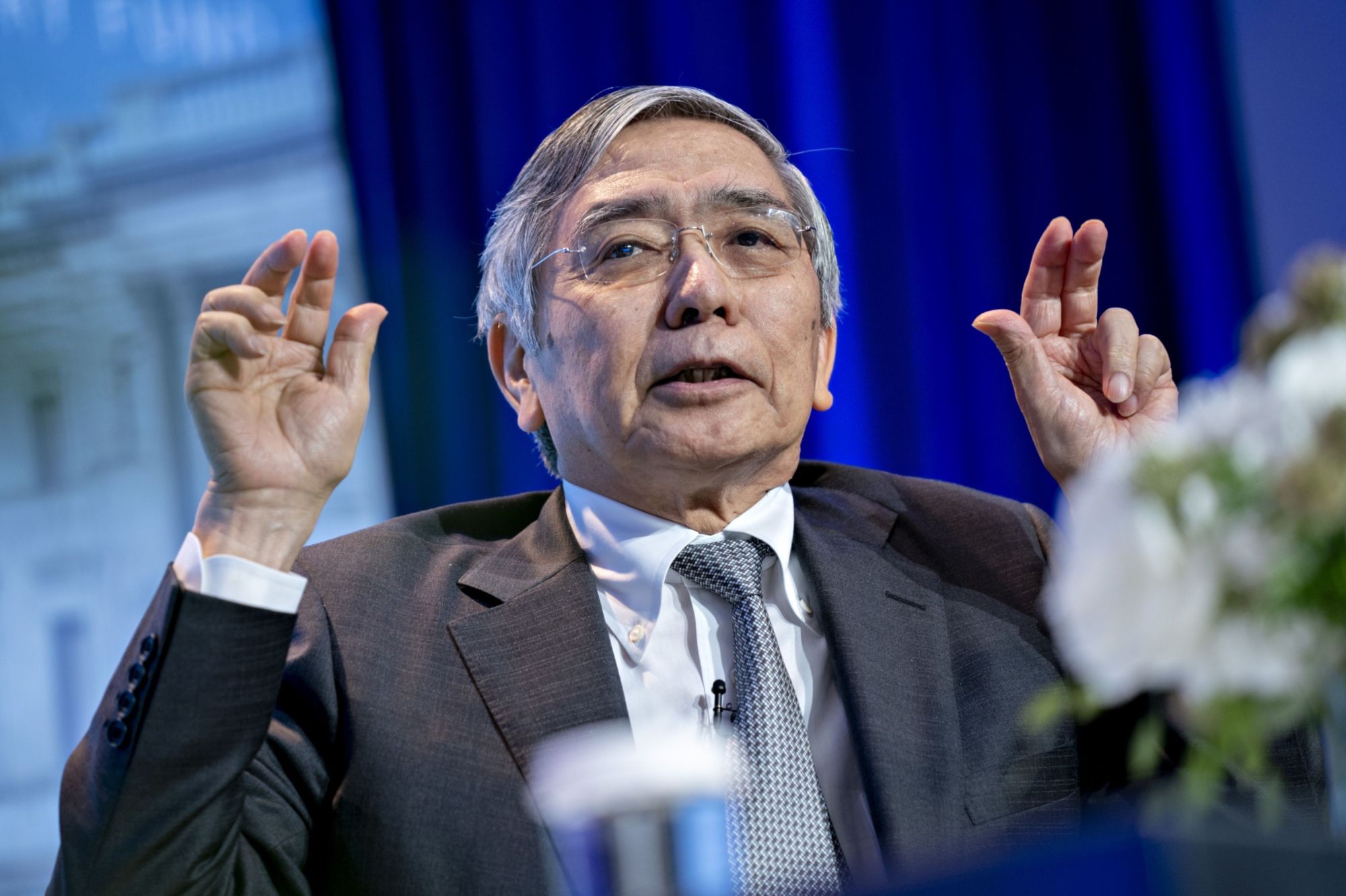 Bank of Japan Gov. Haruhiko Kuroda speaks at the International Monetary Fund in Washington on July 22. | BLOOMBERG