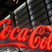 Coca-Cola (Japan) Co. aims to raise the ratio of recycled materials in the plastic bottles it uses to 90 percent by 2030. | GETTY IMAGES