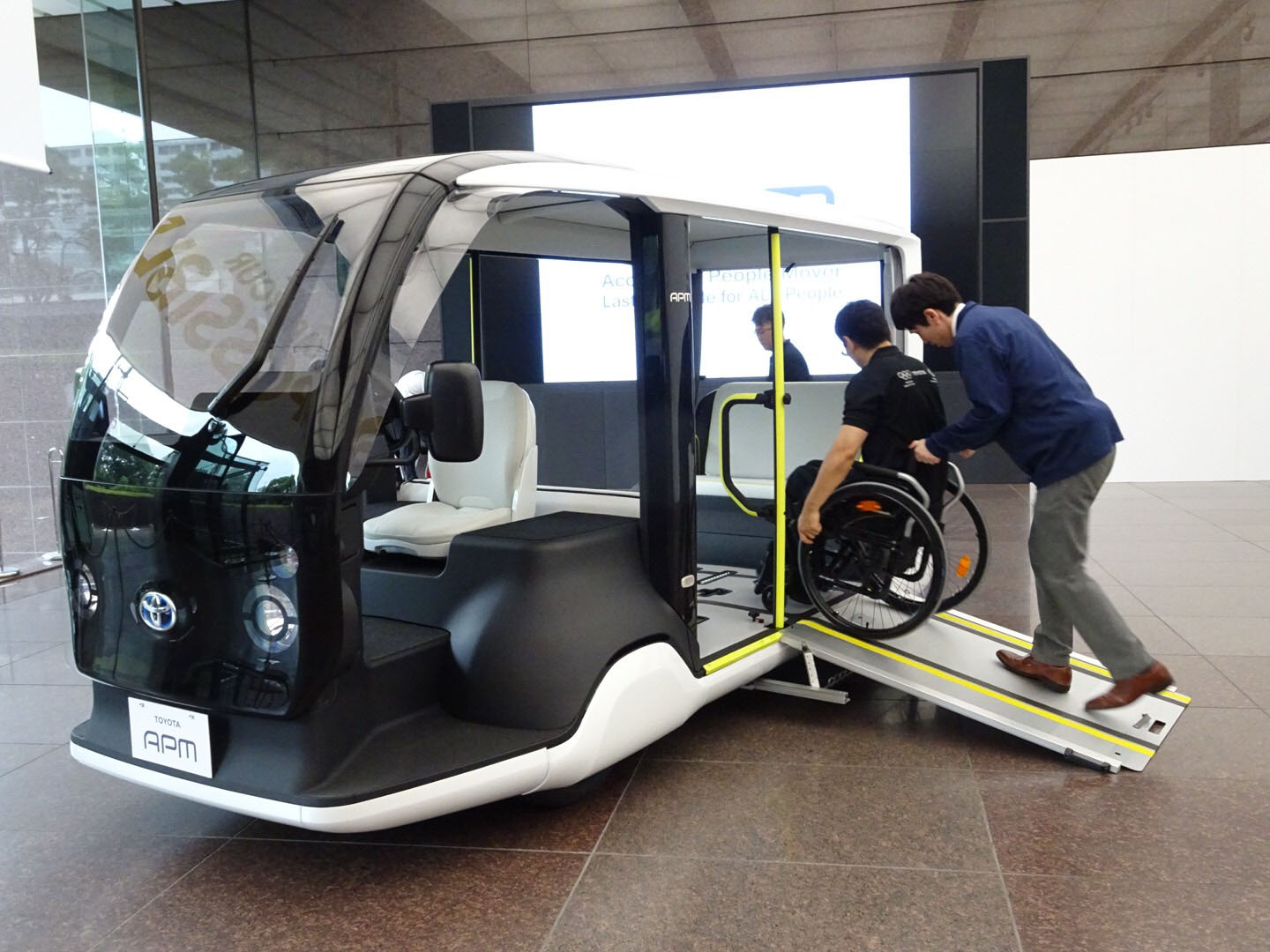 Toyota Motor Corp. shows off an electric vehicle designed to transport people around venues for the 2020 Olympics, at its headquarters in Tokyo on Thursday. | KAZUAKI NAGATA