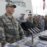 Chinese President Xi Jinping speaks after reviewing the Chinese People\'s Liberation Army Navy fleet in the South China Sea in April last year. China has announced large-scale military exercises in broad swaths of the waters and airspace in both the South and East China seas near Taiwan for this week. | AP