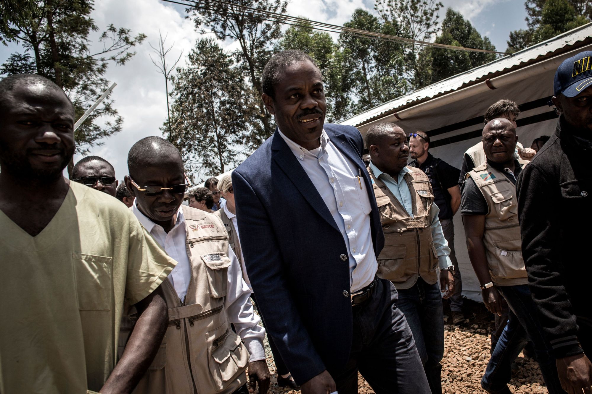 Minister of Public Health Dr. Oly Ilunga Kalenga visits an Ebola Treatment Center (ETC) that was attacked in the early hours of the morning in Butembo, Congo. Ilunga resigned Monday, citing his removal as the head of his country's Ebola response and concerns over a proposed 'experiment' with a new, unlicensed vaccine. | AFP-JIJI