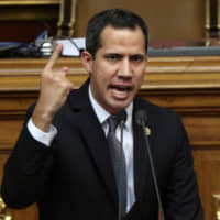 Venezuelan opposition leader Juan Guaido, who many nations have recognised as the country\'s rightful interim ruler, speaks during the session of Venezuela\'s National Assembly in Caracas Tuesday. | REUTERS