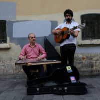 Syrian musicians, refugees from Aleppo, perform in central Istanbul in June. | REUTERS