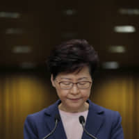 Hong Kong Chief Executive Carrie Lam pauses during a news conference in Hong Kong on Tuesday. | AP