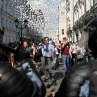 Protesters face police at a rally calling for opposition candidates to be registered for elections to Moscow\'s regional legislature on Saturday. | REUTERS