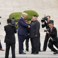U.S. President Donald Trump meets with North Korean leader Kim Jong Un at the Demilitarized Zone separating the two Koreas, in Panmunjom, South Korea, on June 30. | REUTERS