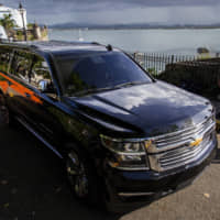Puerto Rico Gov. Ricardo Rossello\'s motorcade leaves La Fortaleza in San Juan Sunday. Protesters are demanding Rossello step down for his involvement in a private chat in which profanities were used to describe an ex-New York City councilwoman and a federal control board overseeing the island\'s finances. | AP