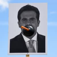 A banner with a picture of Puerto Rico\'s Gov. Ricardo Rossello is seen during the national strike calling for his resignation in San Juan Monday. | REUTERS